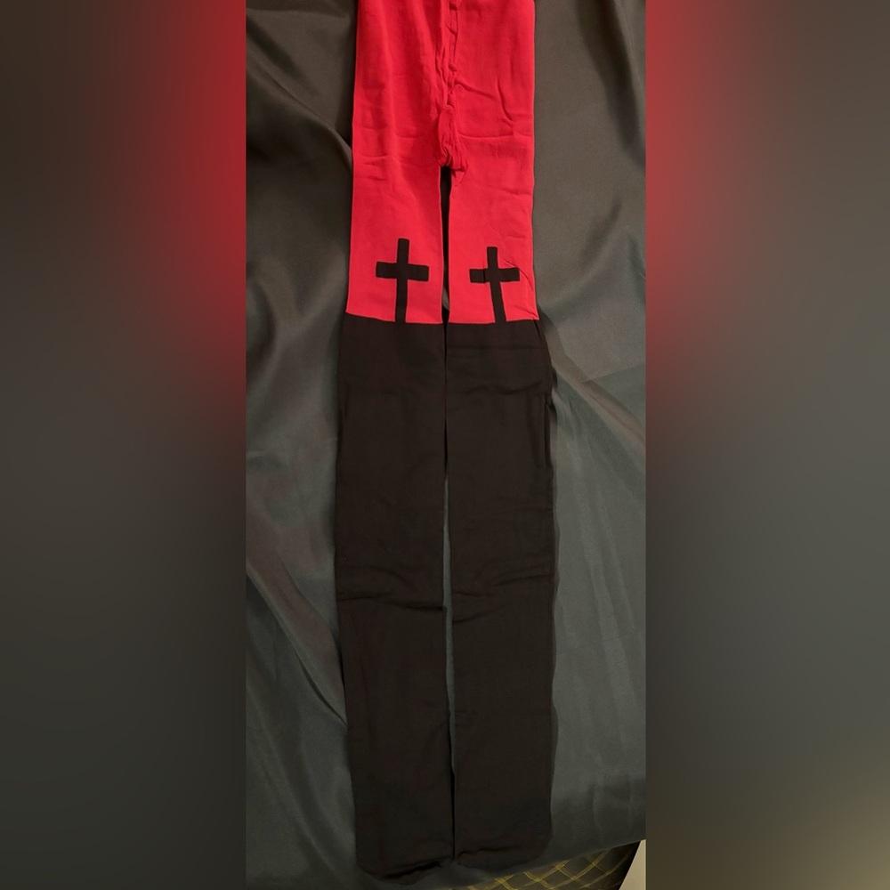 Red and black tights with cross on front